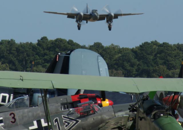 De Havilland Mosquito (N114KA) - de Havilland Mosquito on final. An amazing Warbirds over the Beach 2021 airshow at Jerry Yagen’s Military Aviation Museum at Pungo, VA near Virginia Beach, 2-3 October 2021. If you’ve never attended one of his airshows, you ought to check it out. Multiple formations of US Army Air Corps, US Navy, RAF, and German aircraft. With Covid, this show was a combined WWI, WWII, etc. airshow. 