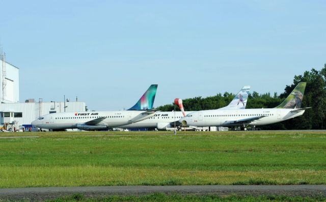 Boeing 737-200 (C-GNDF) - In the foreground and to the left is C-FACP, and in the background is C-FFNC