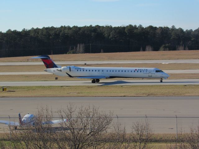 Canadair Regional Jet CRJ-900 (N299PQ) - Delta Connection (Endeavor Air) flight 3719 to La Guardia, a Bombardier CRJ900 taxiing to takeoff on runway 23R. This was taken January 30, 2016 at 4:08 PM.