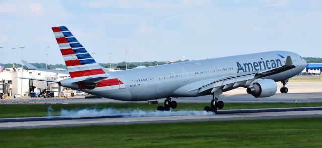 Airbus A330-300 (N271AY) - One of US Airways old A333s smoking the mains - somewhat obscured by a cloud - but still beautiful.  From the CLT overlook, 7/4/18.