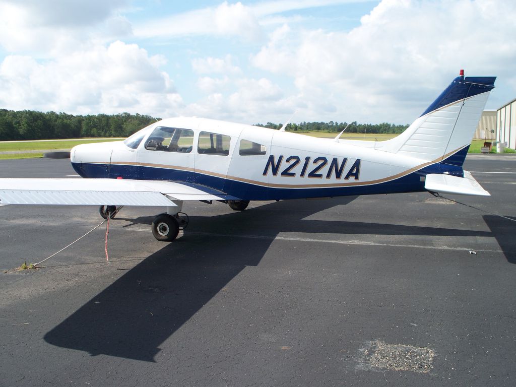 Piper Cherokee (N212NA) - Parked at CXO.