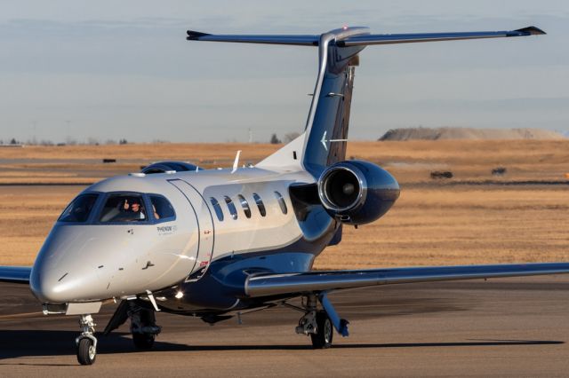 Embraer Phenom 300 (N420TJ) - Taxiing in to Customs from SLC with a friendly crew on board. 