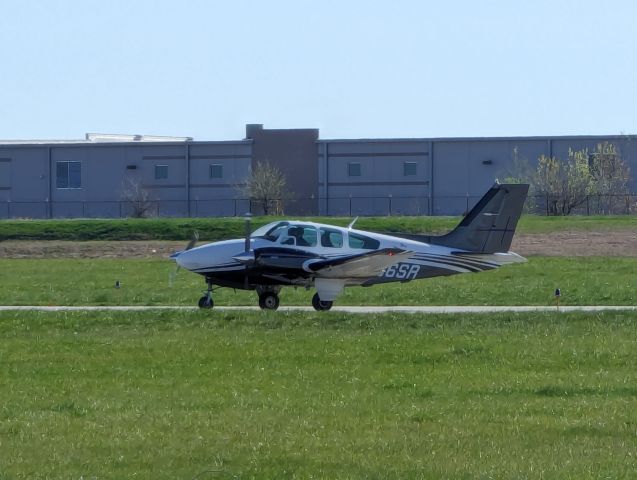 Beechcraft 55 Baron (N66SR) - Departure end of Runway 36, among the meadowlarks and Red Wing blackbirds 