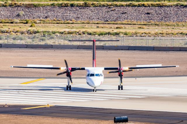 de Havilland Dash 8-100 (N992BH) - A Bighorn Dash 8-100 taxiing at PHX on 2/28/23. Taken with a Canon R7 and Canon EF 100-400 L ii lens.