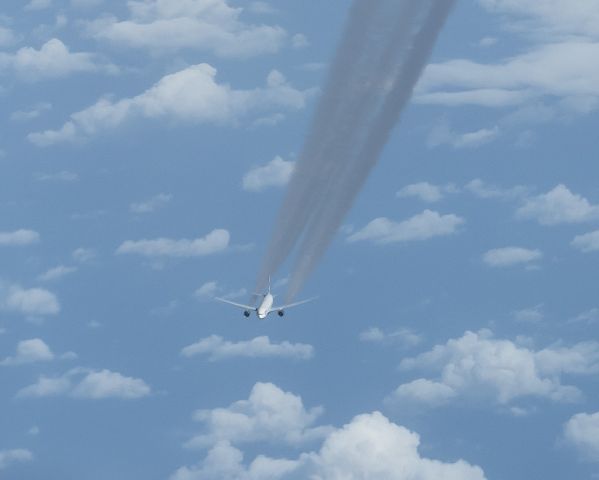 Boeing 777-200 — - Over Atlantic approaching Canada flying East to West - BA 777 passing underneath