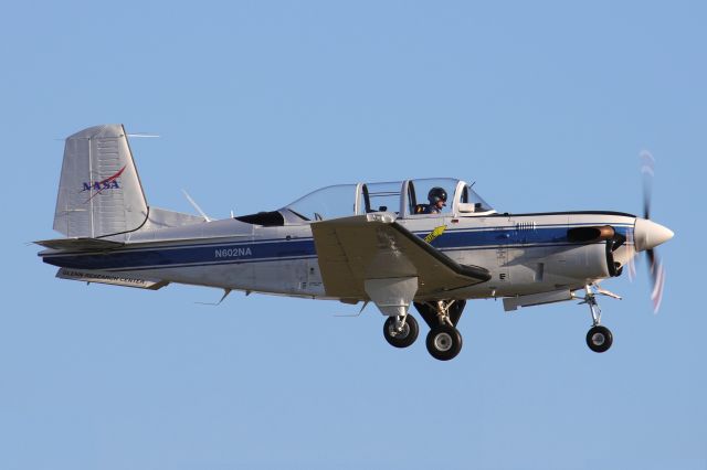 Beechcraft Mentor (N602NA) - A surprise catch of a new NASA T-34C Mentor, 160944, c/n GL-130, from the NASA Glenn Research Center on final for RWY 24R on 4 Nov 2020.