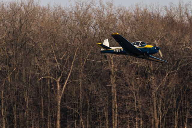 North American Navion (N4897K) - Navion sending it at KMGY with a low pass and wing wave!