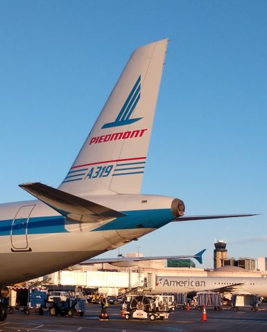 Airbus A319 (N744P) - Piedmont retro arriving at the gate from PVDbr /br /12/16/18