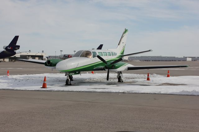 Cessna 404 Titan (N404MG) - Key Lime Air operates two Titans out of DIA cargo, flying for UPS.  This one had its starboard engine pulled out after only about 100 hours, but its still under warranty.