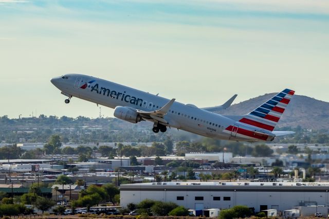 Boeing 737-800 (N988NN) - American Airlines 737-800 taking off from PHX on 9/28/22. Taken with a Canon 850D and Rokinon 135mm f/2 manual focus lens.