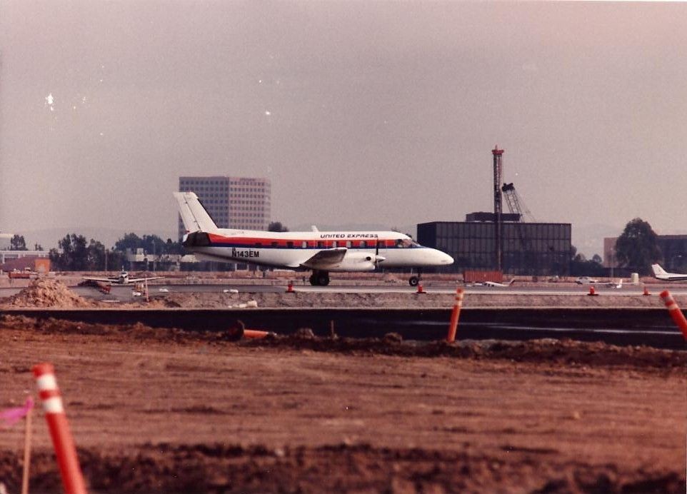 Embraer EMB-110 Bandeirante (N143EM) - United Express Embraer at Santa Ana in the late 1980s