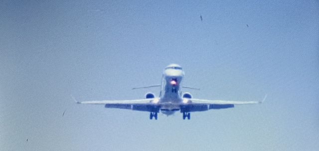 Canadair Regional Jet CRJ-900 (N561NN) - This is a really good shot that I took off an American eagle crj-900 on final approach to Wilkes-Barre Scranton International airport. This aircraft was built in 2014 and still flies today. I shot this photo while he was further away, so you can actually see the front of the plane pretty well, along with the flaps fully lowered and the speed brakes deployed for landing.