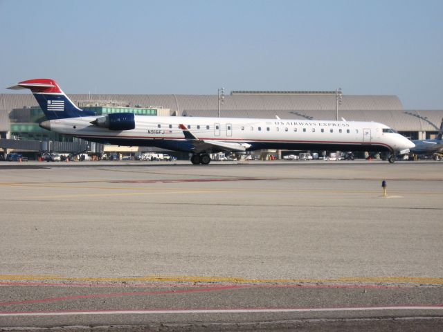Canadair Regional Jet CRJ-900 (N916FJ) - Holding on RWY 19R