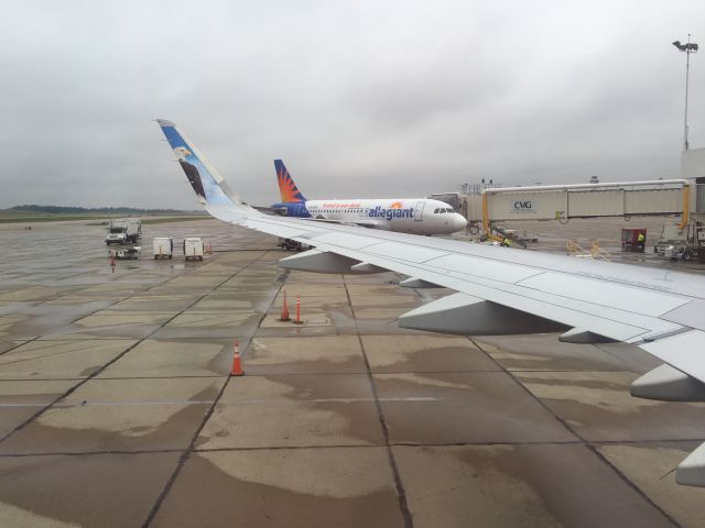 Airbus A321 — - On board Frontier flight 733 from Cincinnati/Northern Kentucky to Denver International (KDEN) on the evening of July 3, 2016. The Allegiant Air (N303NV) in the background was delayed to Myrtle Beach (KMYR).