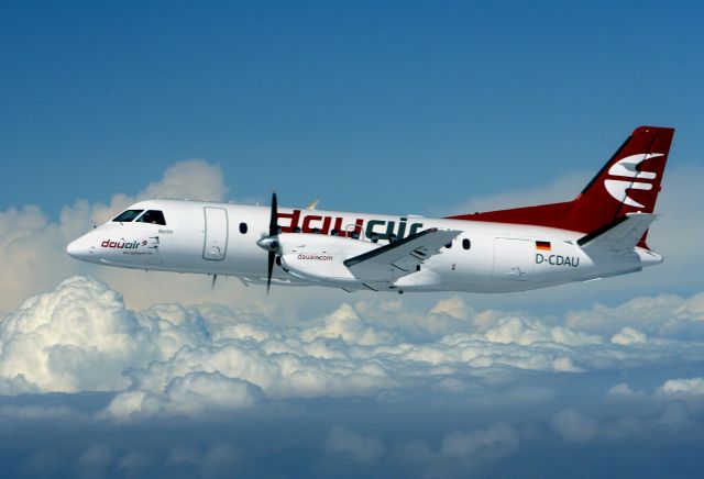 Saab 340 (D-CDAU) - This photo was taken from a Beech 36, flying in formation with the Saab. That is the reason for the high nose up pitch, due to the speed differences. The Beech flew on the red mark of the speed indicator. This Saab, named Berlin, was the second aircraft of the former dauair AG. It was on a ferry flight from Bremen to Dortmund (Germany).