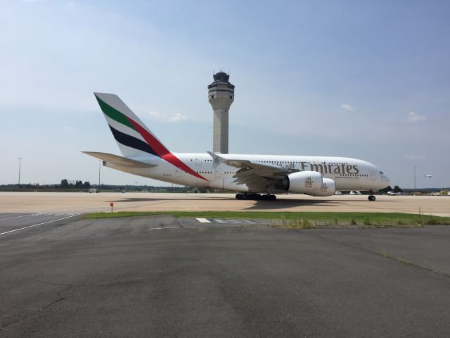 Airbus A380-800 (A6-EUE) - Emirates A380 with the FAA tower in the background at IAD