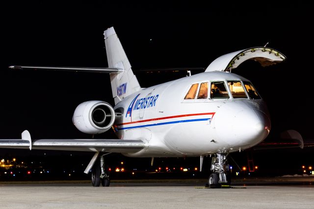 Dassault Falcon 20 (N158TW) - Ameristar Falcon 20 unloading on a brisk and windy night!