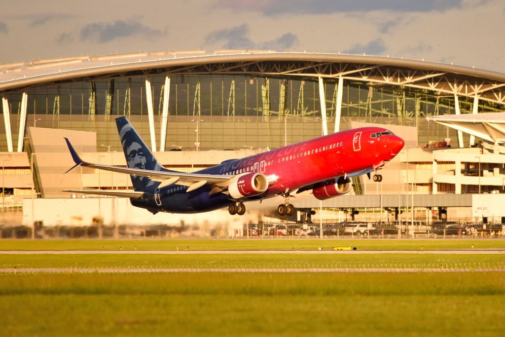Boeing 737-900 (N493AS) - 23-R 09-25-22. Nice backdrop with the IND terminal. IND is blessed with a great terminal, inside and out. 