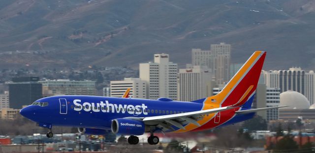 Boeing 737-700 (N497WN) - Framed by downtown Reno in the background, Southwests N497WN is caught here as it is gliding in toward runway 16R at Reno Tahoe International.  In the next picture, this same B737 can be seen only a few seconds later as it passes my location and is about to touch down.  