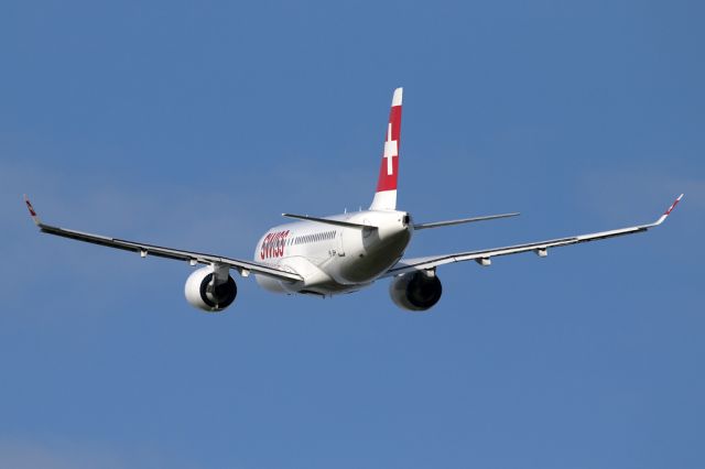 Bombardier CS100 (HB-JBH) - SWR391 with the gear stowed after departure from Manchester en route to Zurich.