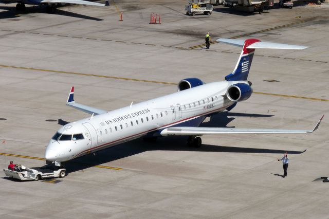 Canadair Regional Jet CRJ-900 (N905J) - Mar. 28, 2009 - pushing back.