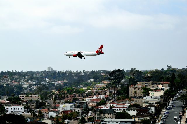 Airbus A320 (N633VA) - Virgin America coming in to San Diego, 2016.  Photo taken from my balcony of the Double Tree Downtown. 