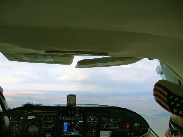 Cessna Centurion (N210WM) - Flying in SW Kansas.