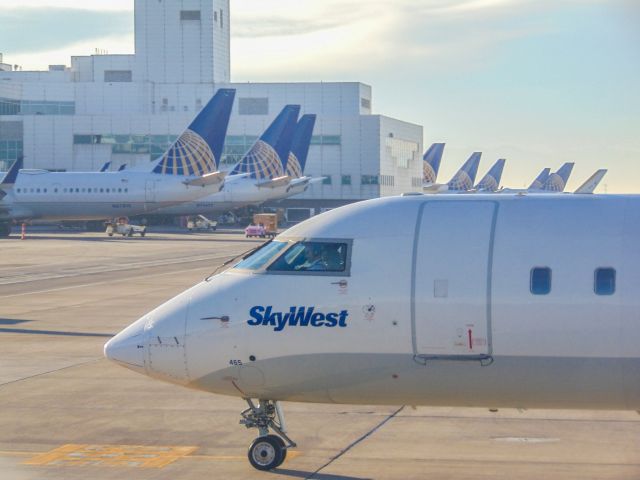 Canadair Regional Jet CRJ-200 (N465SW) - Here, a SkyWest CRJ-200 has pushed back from a regional gate in Denver on its way to Winnipeg!