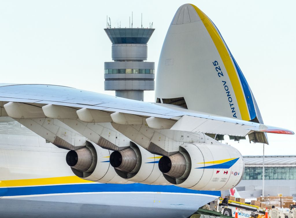 Antonov An-225 Mriya (UR-82060) - Compression of a long lens making the infield tower seem much closer than it really is. Artsy shot of the Antonov.