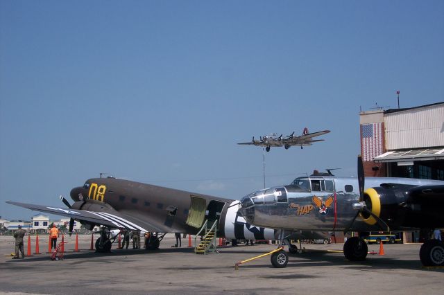 — — - A trio of warbirds, C-47, B-25 and a B-17 on short final at FRG.