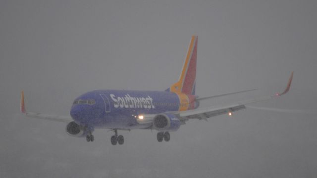 BOEING 737-300 (N355SW) - On short final for 28R in a heavy snow squall.