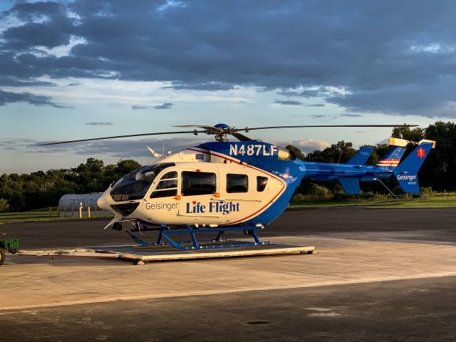 KAWASAKI EC-145 (N487LF) - GEISINGER LIFE FLIGHT coming back to base in Selinsgrove, PA after a night flying with 4 onboard. Check out that beautiful backdrop whilst resting on the transporting pad.