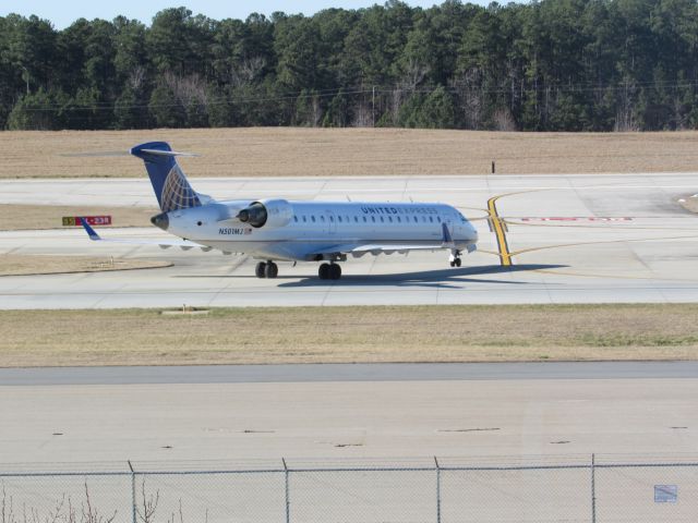 Canadair Regional Jet CRJ-700 (N501MJ) - United Express (Mesa) flight 4017 to Washington Dulles Intl, a Bombardier CRJ700 is taxiing to runway 23R to takeoff. This was taken January 30, 2016 at 2:53 PM.