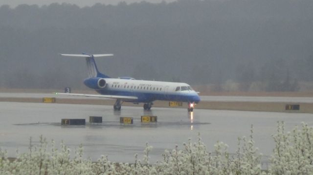 Embraer ERJ-145 (N842HK) - "Blue Tulip" or "Shades of Blue" lives RDU for the last time.  Taken March 19, 2015.