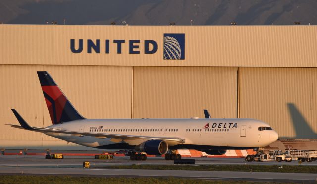 BOEING 767-300 (N178DN) - Getting towed to gate at LAX