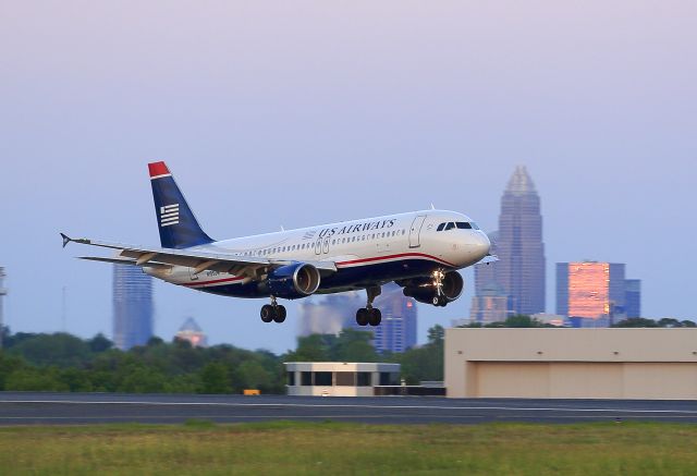 Airbus A320 (N105UW) - Evening landing at Charlotte, North Carolina USA. The significance of this photo is that this aircraft, an Airbus A320, is the sister-ship of N106UW, the "Miracle on the Hudson" airplane, which was also an A320.