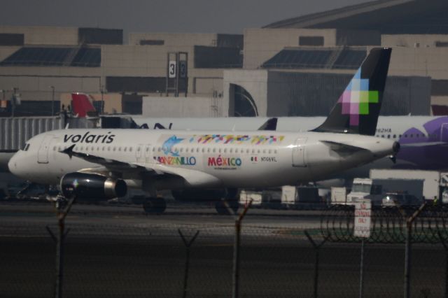 Airbus A320 (N506VL) - Volaris A320 taxis into gates @ LAX T2.  (MANZANILLO ad from 2014)