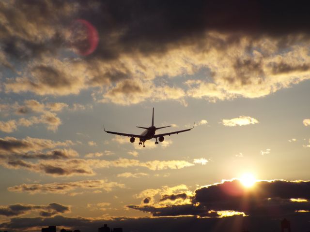 Boeing 737-700 — - Sunset landing during sunset at runway 27 at Logan Airport.