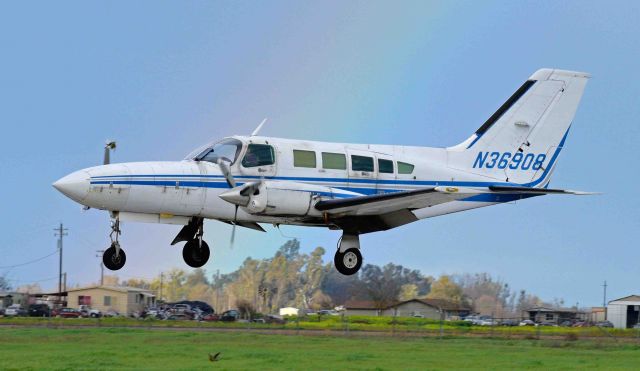 Cessna 402 (N36908) - A rainbow in in the background