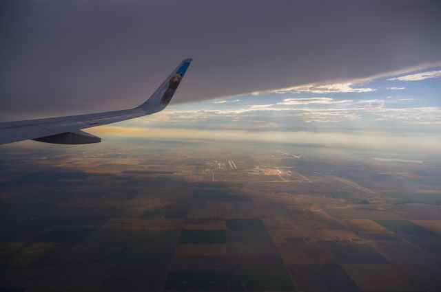 Airbus A320 — - An overview of KDEN nearing sunset seen from a downwind on approach to 35R.