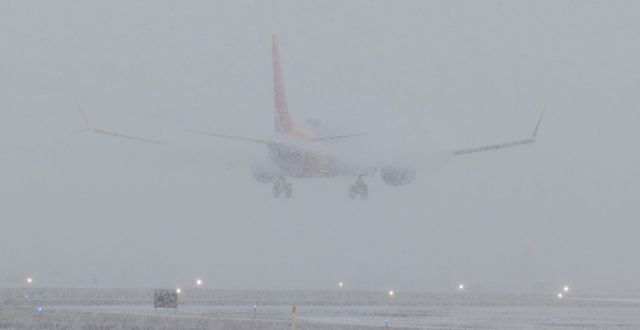 Boeing 737 MAX 8 (N8702L) - A Southwest flight is barely visible as it has just passed over the numbers of RNO's 35R and is about to touch down to complete a trip from San Jose (KSJC).br /This SW was the second-to-last commercial pax bird to land at RNO before the rapidly increasing-in-intensity blizzard degraded the visibility to below minimums and forced seven other commercial flights -- flights that were either circling over RNO or were not too far from arriving at Reno -- to divert. Shortly after one more Southwest flight landed just behind this one, a GA jet was able to land on 35R at 1031 hours and that GA bird was the last arrival at RNO until 1920 hours ... almost nine hours later.br /With RNO's only ILS - and longest - runway closed for construction (35L-17R, 11001 feet) and the below minimums visibility making it impossible to see the 9000 foot long 35R-17L, seven flights that were either at or almost to Reno had to divert.br /AA 2722 from KDFW diverted to KFAT (Fresno Yosemite). SkyWest 3501, inbound from KLAX, also went to KFAT. SWA 2340, just arriving from San Diego (KSAN), turned around and flew all the way back to KSAN which meant its passengers flew for 2 hours and 41 minutes only to end up where they had started. AA 1777, approaching Reno from Phoenix (KPHX), reversed course and diverted to KLAS. UA 375, coming to Reno from KDEN, turned around at the Utah/Nevada border at West Wendover and went back to Denver. Frontier's 2175 made a 180 and went back to Las Vegas where it had come from. And AA 2538 from KDFW decided to go to Phoenix. And since there weren't any aircraft arriving for me to photograph, and also because I couldn't have seen squat even if there had been any aircraft, I went home. lol