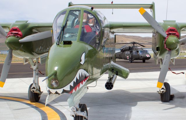 North American Rockwell OV-10 Bronco (N338RC) - This North American OV-10A Bronco was a huge hit at the Carson City Airport Open House.  (So was that Nevada Army "Wolfpack" "60" which is perfectly positioned in the background.)  This super sharp Bronco is just one of many superb aircraft in the Cactus Air Force Wings and Wheels Museum, located at KCXP.