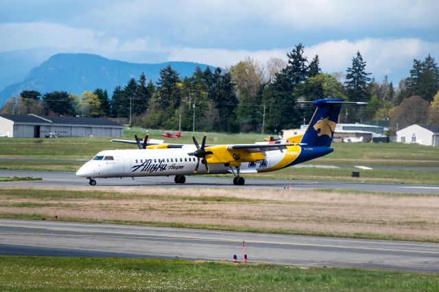 de Havilland Dash 8-400 (N403QX) - Photographed taxiing to the terminal after landing on runway 09 at Victoria Intl. Airport in BC, Canada.