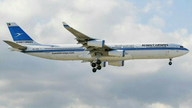 Airbus A340-300 (9K-ANB) - Final approach runway 06 at Manila.