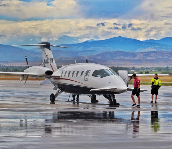 Piaggio P.180 Avanti (N1037W) - A P180 sitting on the apron at KFNL after a thunder storm.