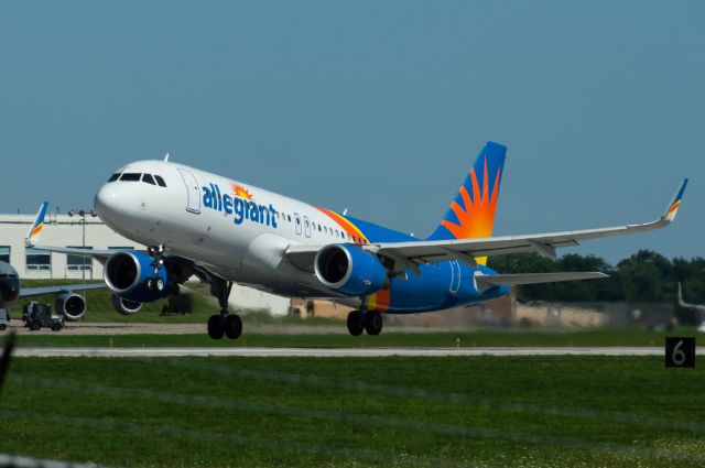 Airbus A320 (N255NV) - Allegiant 2212 thunders off of Des Moines's Runway 31 en route to Orlando Sanford Airport with many vacation travelers taking advantage of Allegiant's low prices and huge route selection out of DSM. Photo taken August 14, 2021 at 2:54 PM with Nikon D3200 at 300mm.