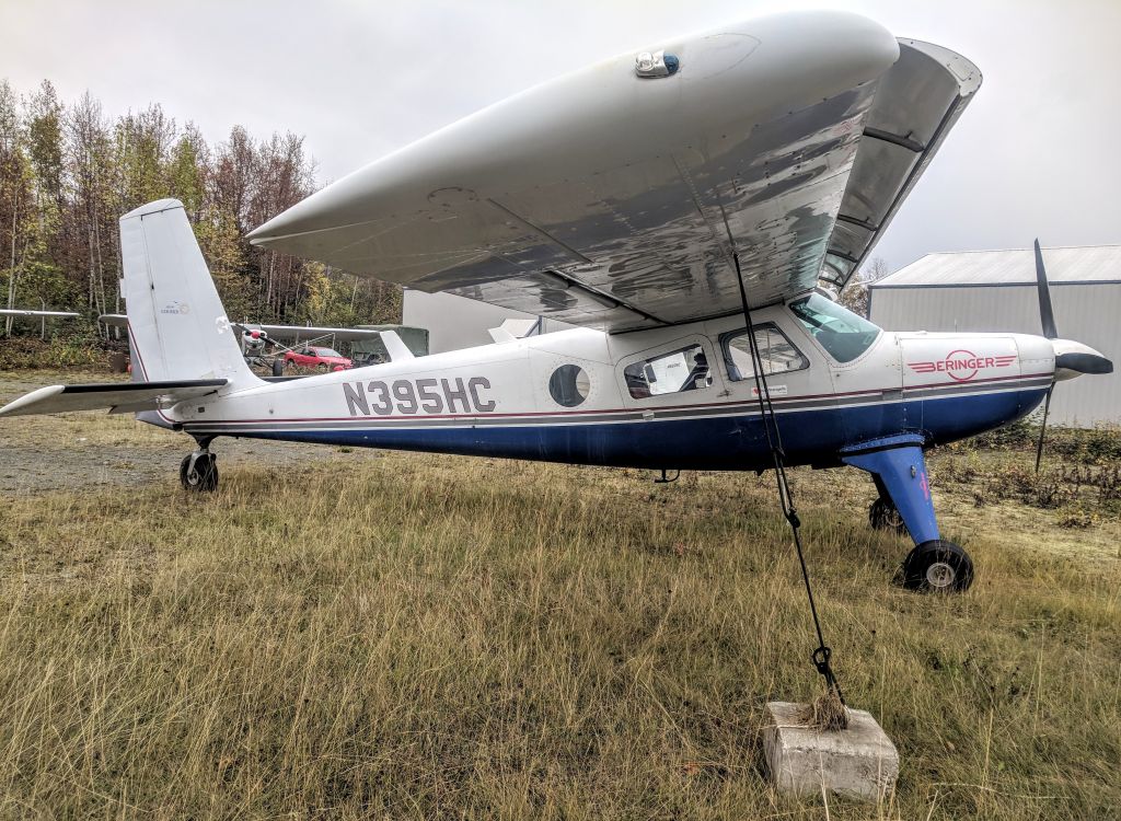 HELIO U-10 Super Courier (N395HC) - Tie-down lot at Birchwood Airport, AK