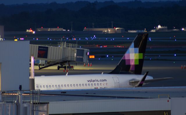 Airbus A320 (XA-VLL) - Volaris A320 which has the word WENY on it sitting at A2 at CVG after being tugged from Concourse B to clear customs.