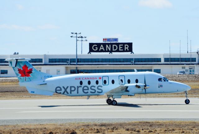 Beechcraft 1900 (C-FEVA) - Taking off on runway 13 at Gander Airport,