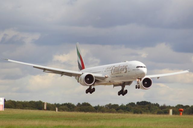 BOEING 777-300ER (A6-EQL) - An Emirates B777-300ER on final approach in to Stansted Airport, landing on runway 22.br /br /Location: Stansted Airport.br /Date: 19.08.22 (dd/mm/yy).